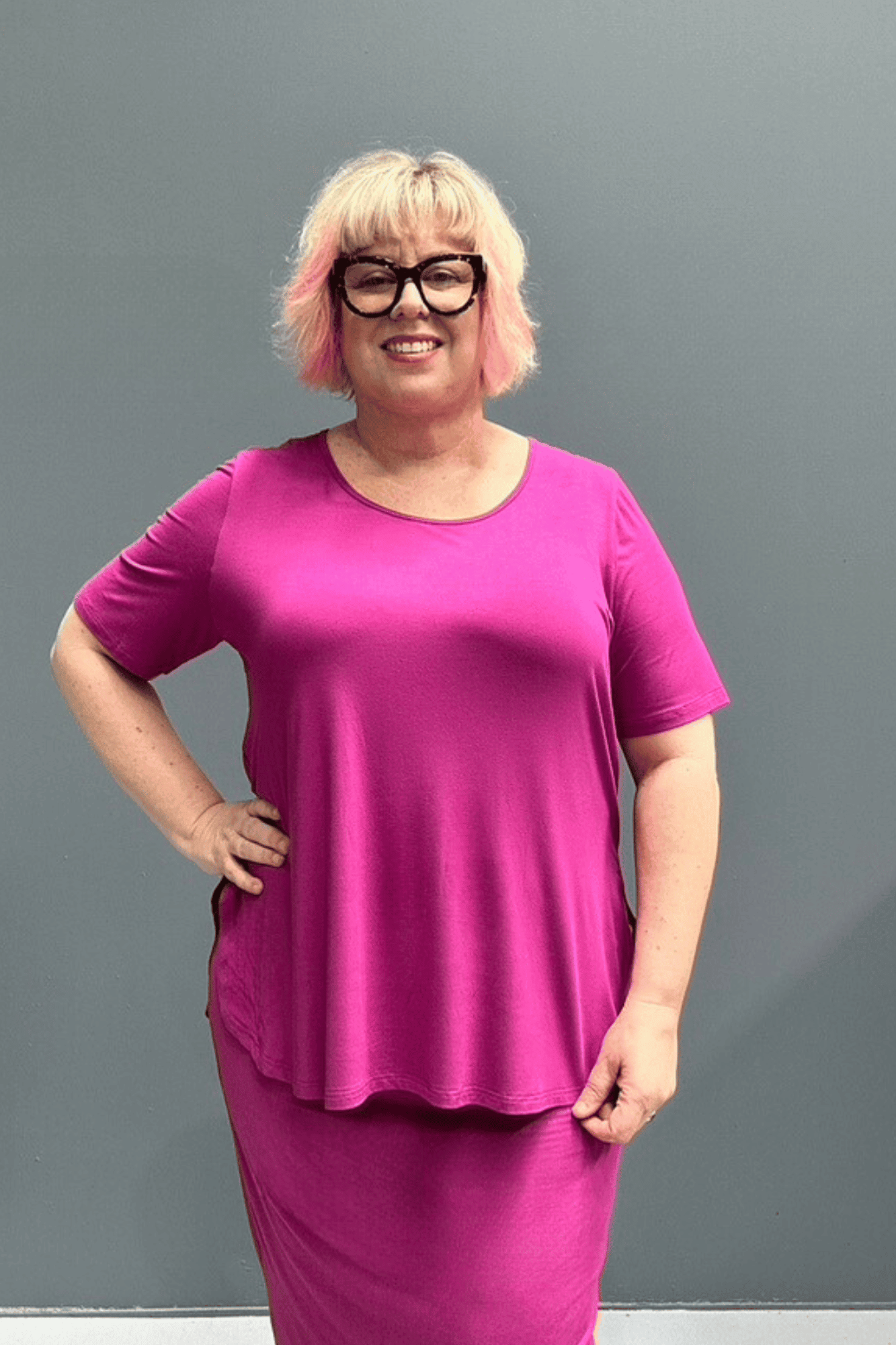 Plus-size fuchsia short-sleeve bamboo top with a relaxed fit.