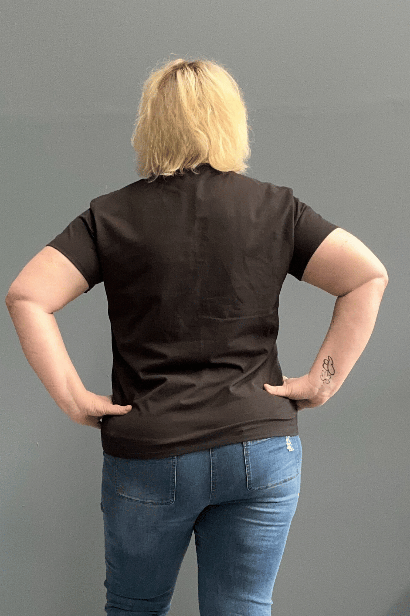 Classic black cotton lycra tee for plus size women, versatile for everyday wear and layering.