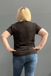 Classic black cotton lycra tee for plus size women, versatile for everyday wear and layering.