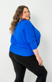 'GEORGIA' plus-size top with a sleek color, batwing cut, and adjustable side ties for a customizable fit.