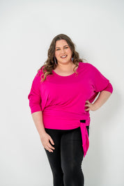 Plus-size Bat Wing Top with a sleek color, batwing cut, and adjustable side ties for a customized fit.