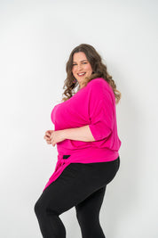 Plus-size Bat Wing Top with a sleek color, batwing cut, and adjustable side ties for a customized fit.