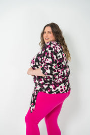 Plus-size 'GEORGIA' Bat Wing Top in pink with a modern geo square print and stylish bat wing design.