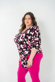 Plus-size 'GEORGIA' Bat Wing Top in pink with a modern geo square print and stylish bat wing design.