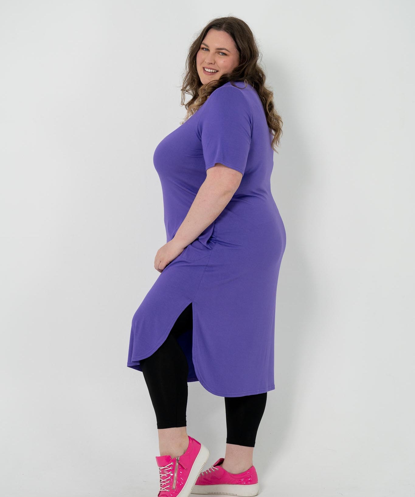 Plus size 'Alana' T-Shirt dress in purple, featuring short sleeves and lightweight material for comfort and versatility, perfect for pairing with an 'AVA' jacket or kimonos.