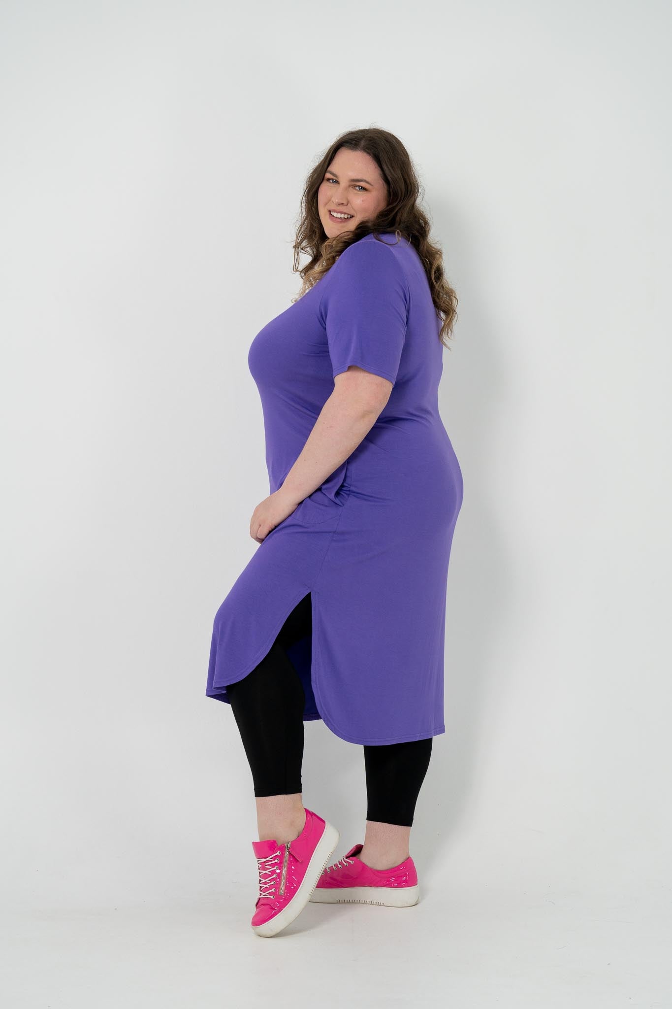 Plus size 'Alana' T-Shirt dress in purple, featuring short sleeves and lightweight material for comfort and versatility, perfect for pairing with an 'AVA' jacket or kimonos.