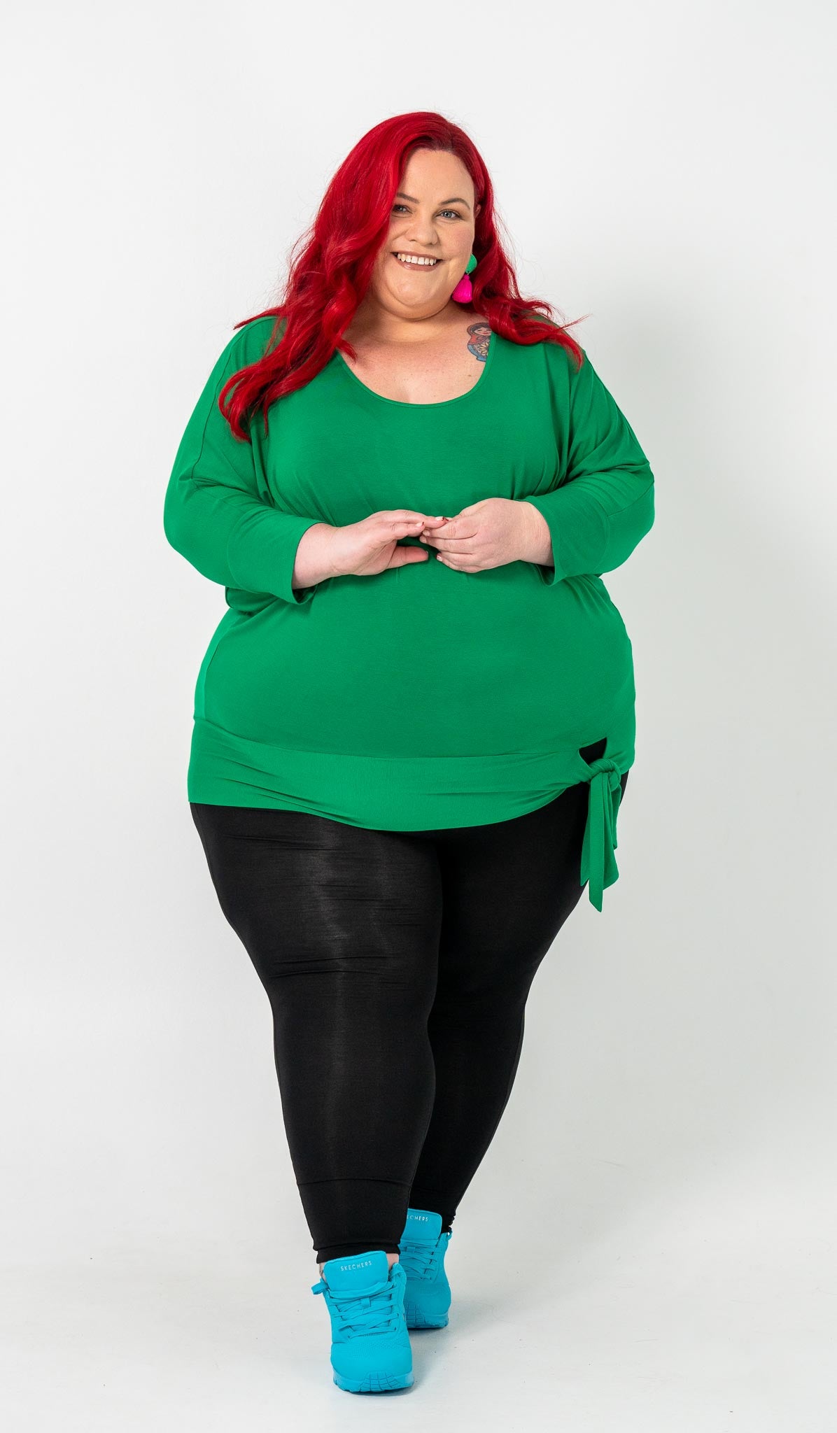 Plus-size Bat Wing Top in Green Tambourine with a stylish batwing cut and adjustable side ties for a customized fit.