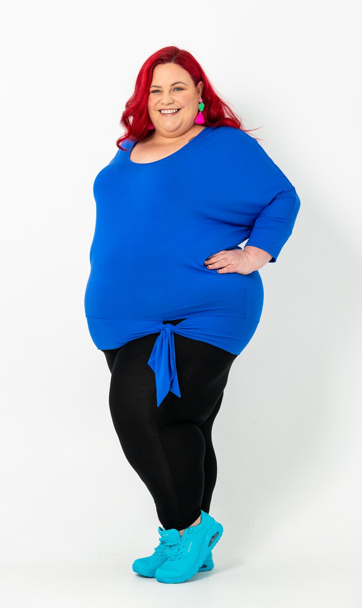 'GEORGIA' plus-size top with a sleek color, batwing cut, and adjustable side ties for a customizable fit.