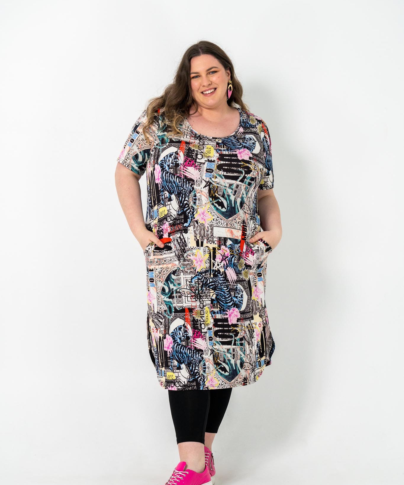 Plus size 'ALANA' T-Shirt dress in vintage poster print, featuring lightweight fabric for comfort and style, perfect for everyday wear.