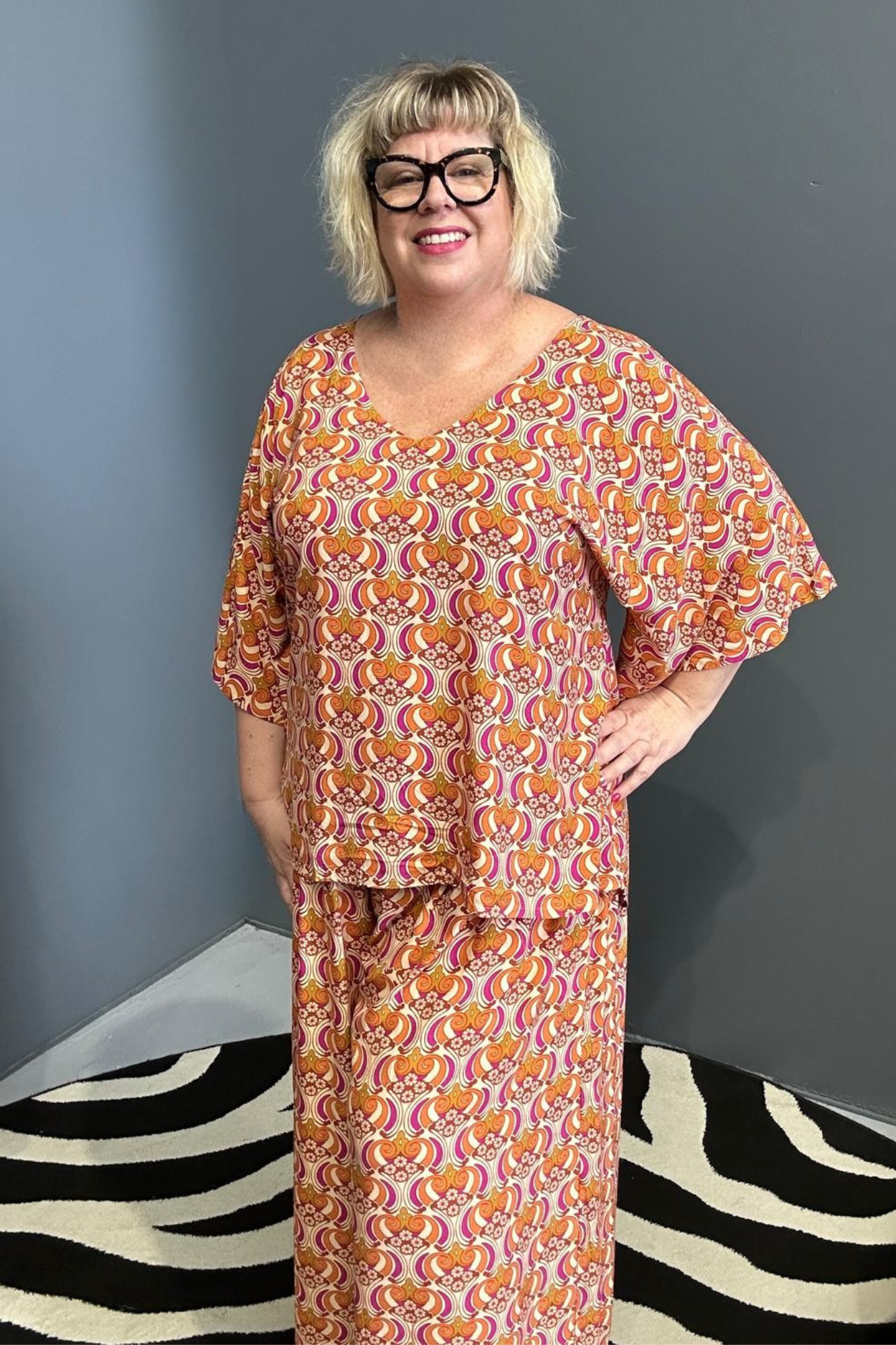 Plus-size orange swirl top with a stylish, flowy fit.