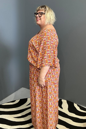 Plus-size orange swirl top with a stylish, flowy fit.