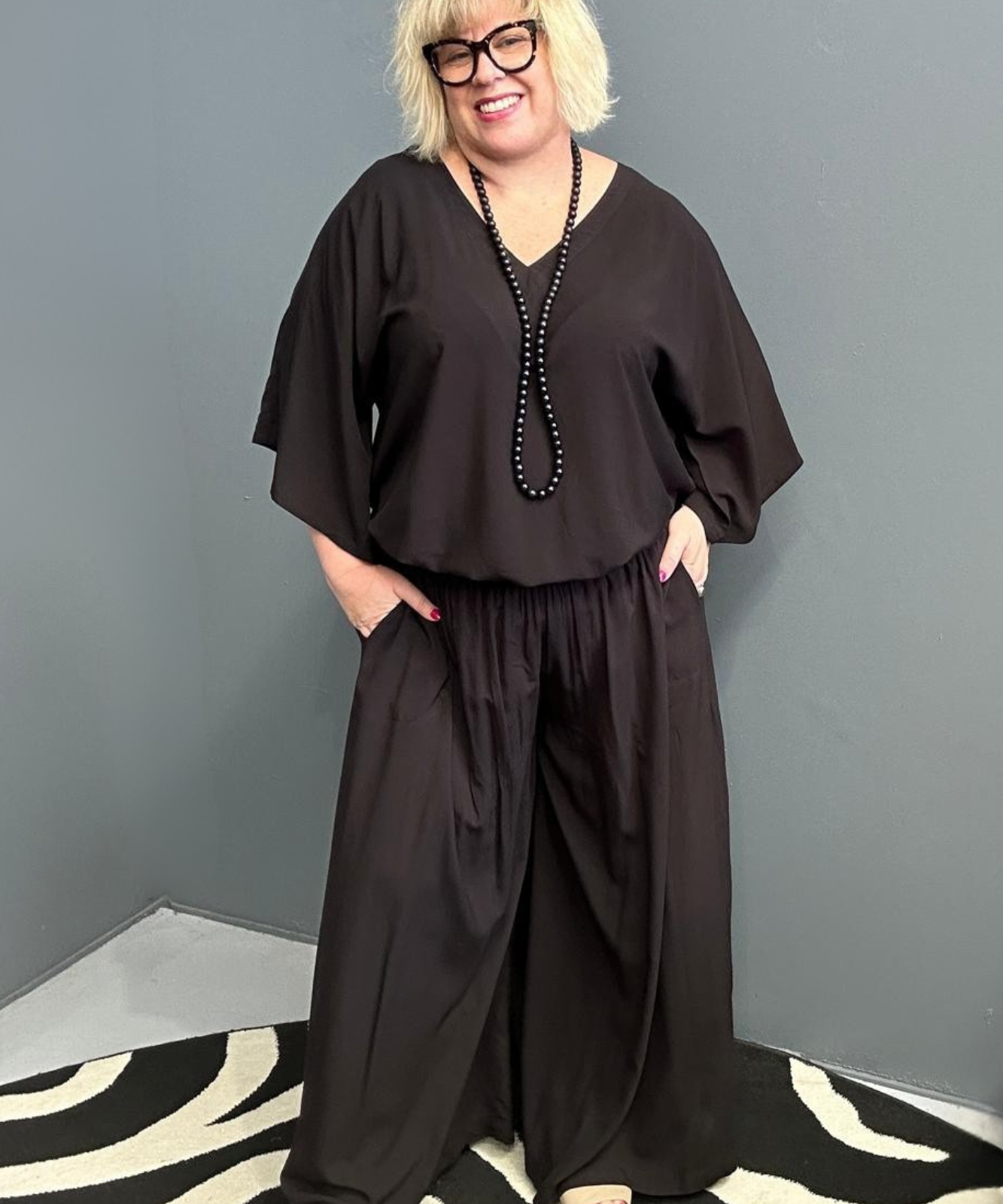 Plus-size black top with a stylish, relaxed fit.
