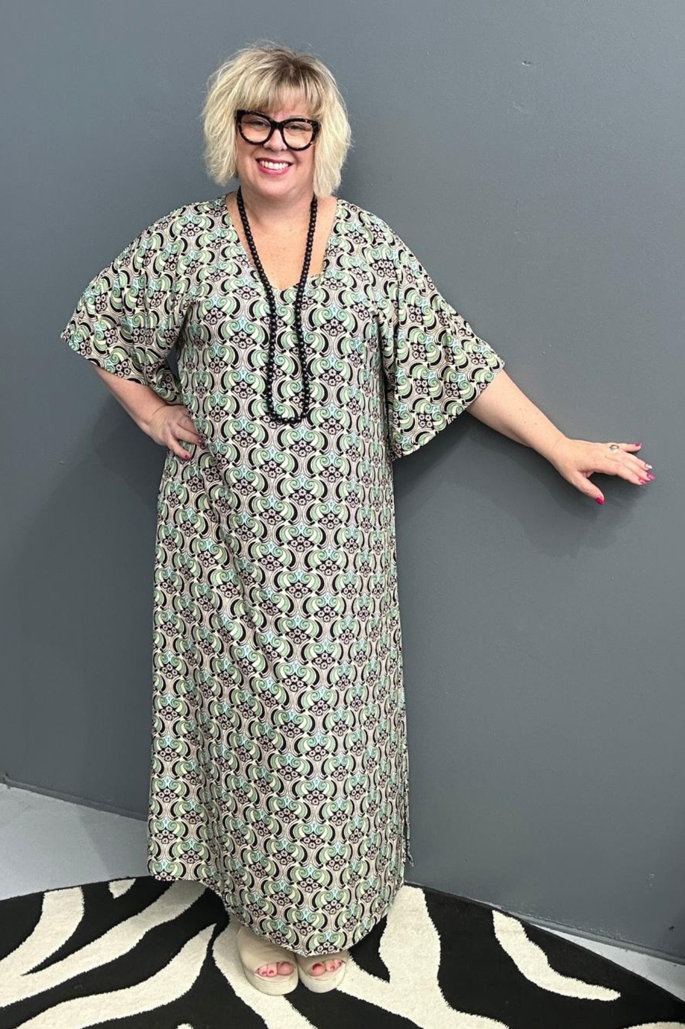 Plus-size mint swirl dress with a flattering fit and graceful flow.