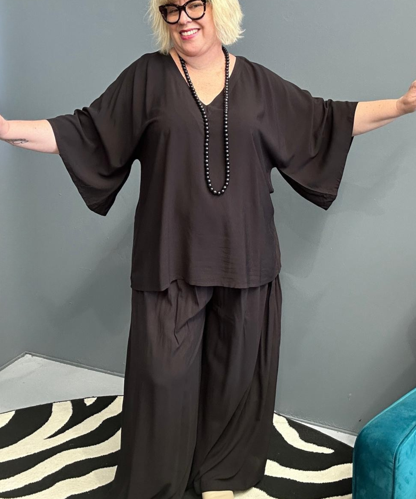 Plus-size black top with a stylish, relaxed fit.