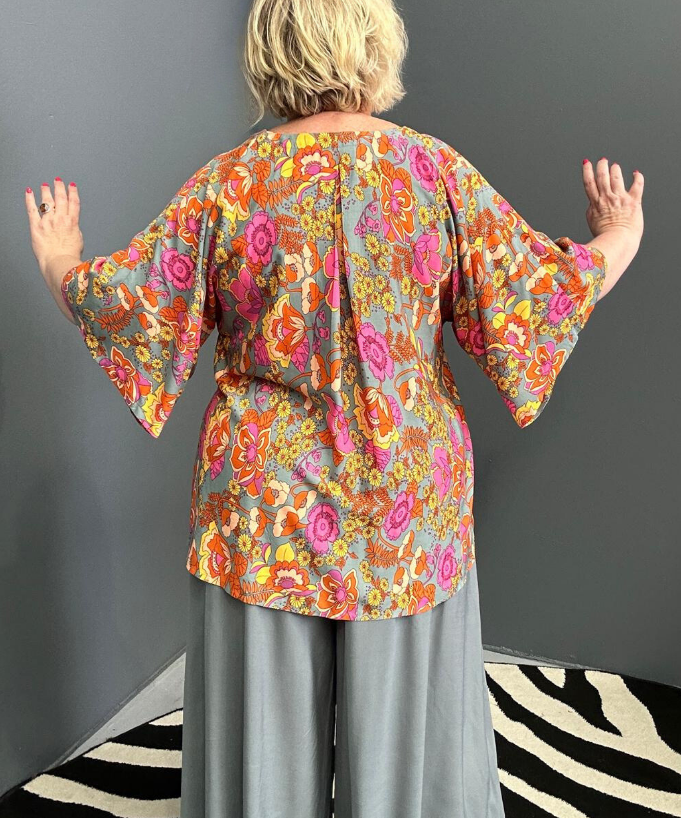 Plus-size sage green top with a breezy, stylish fit.