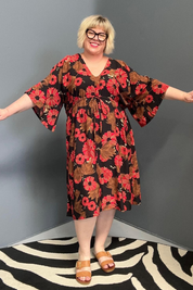 Plus-size black and red floral dress with a flattering drawstring waist.