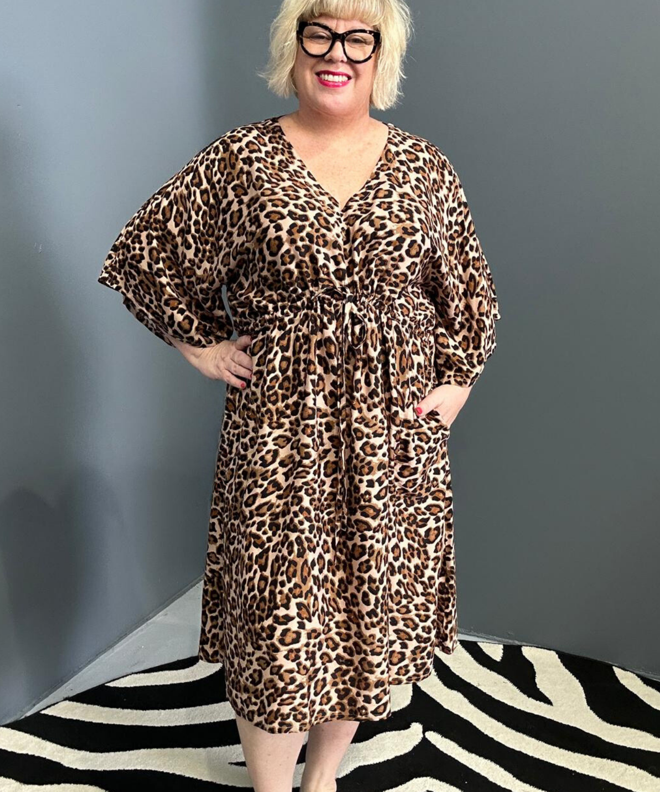Plus-size leopard print dress with a flattering drawstring waist.