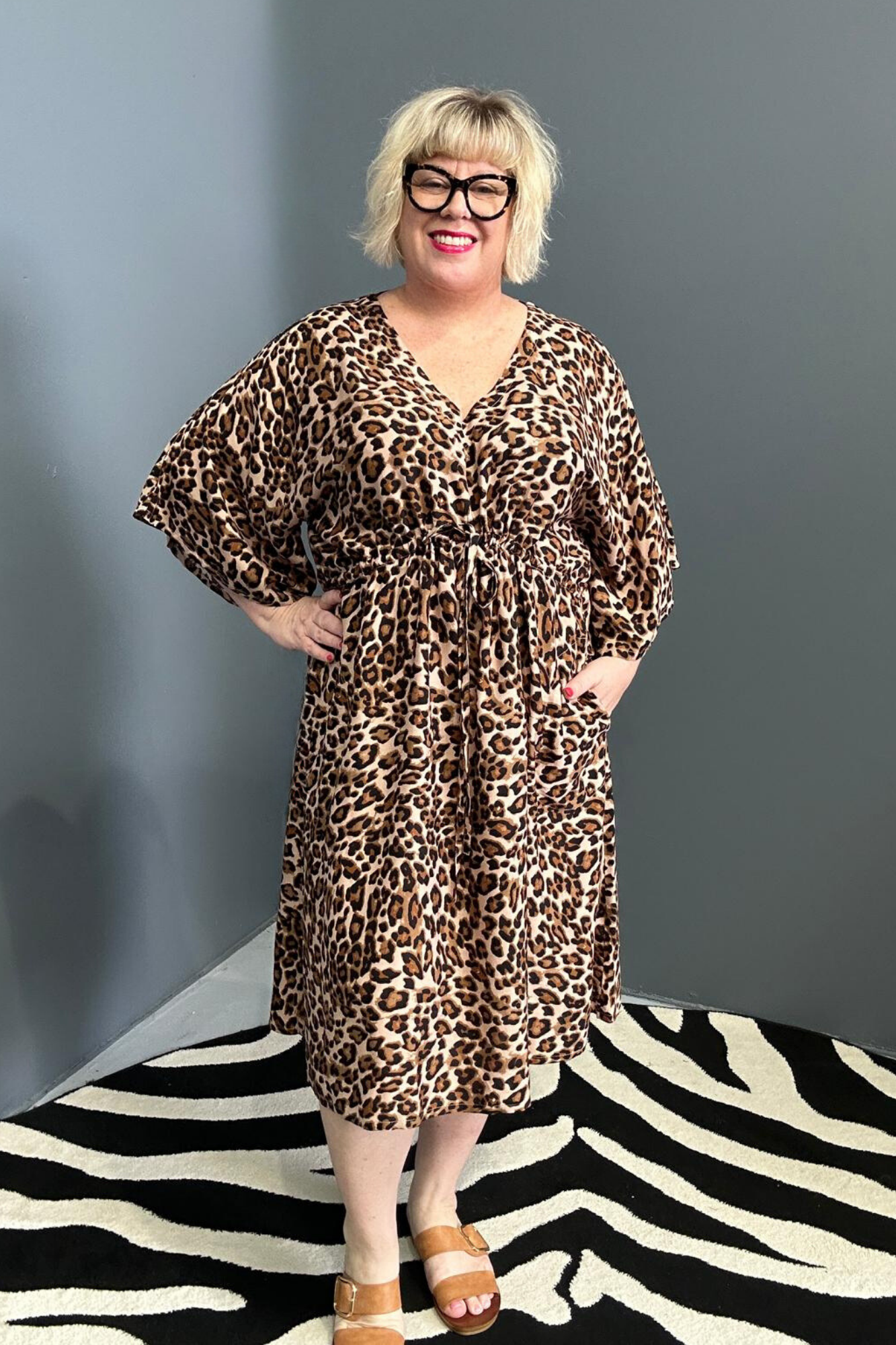 Plus-size leopard print dress with a flattering drawstring waist.