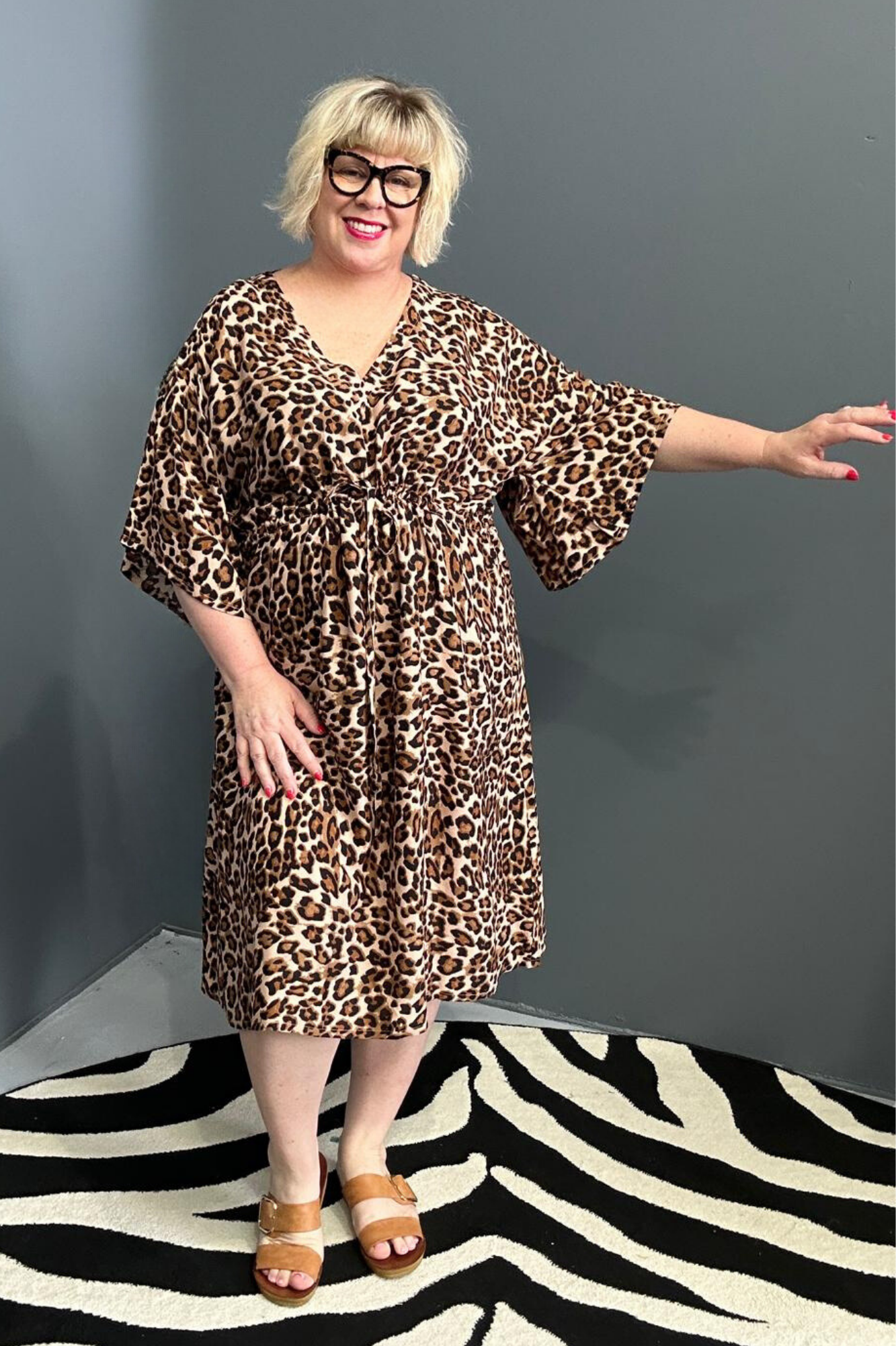 Plus-size leopard print dress with a flattering drawstring waist.