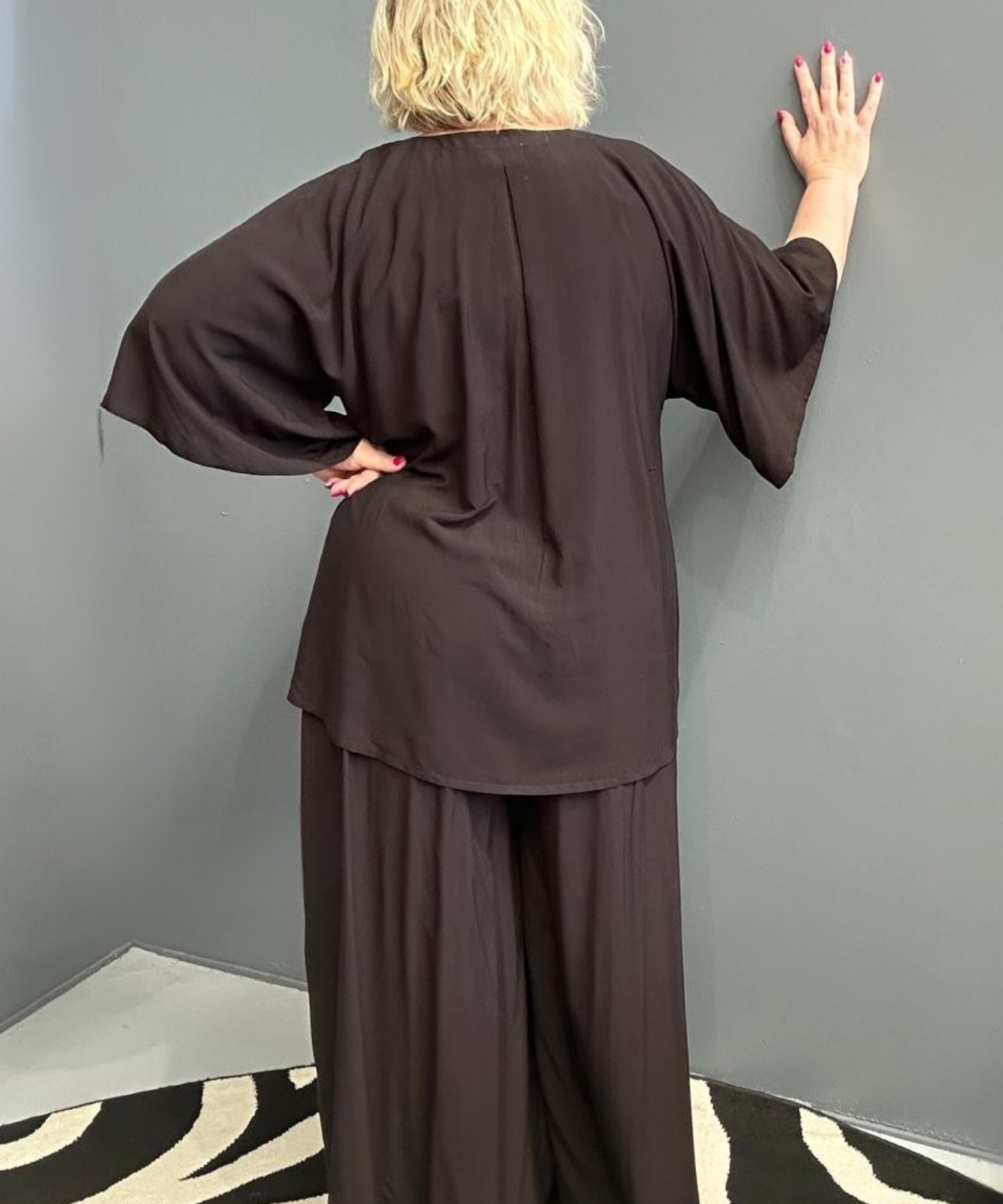 Plus-size black top with a stylish, relaxed fit.