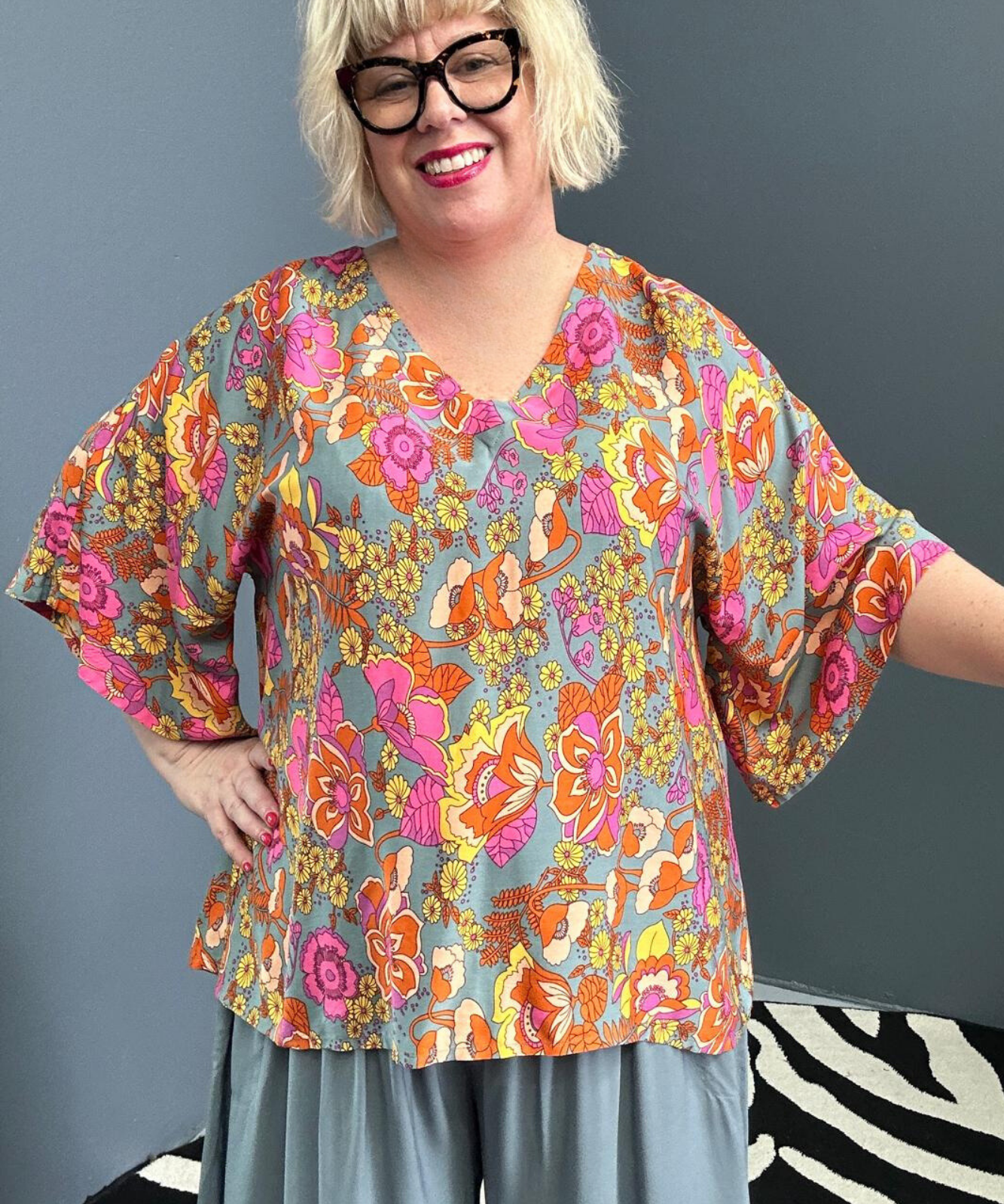 Plus-size sage green top with a breezy, stylish fit.