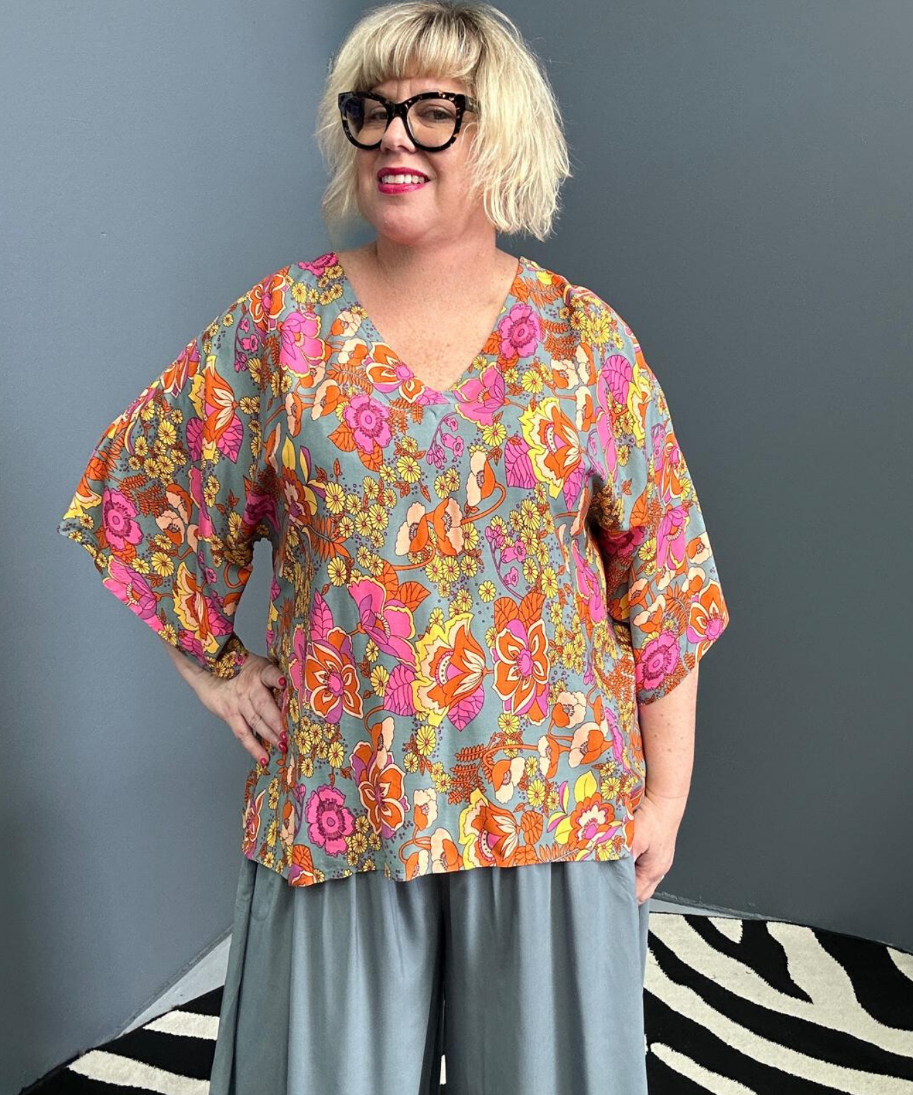 Plus-size sage green top with a breezy, stylish fit.