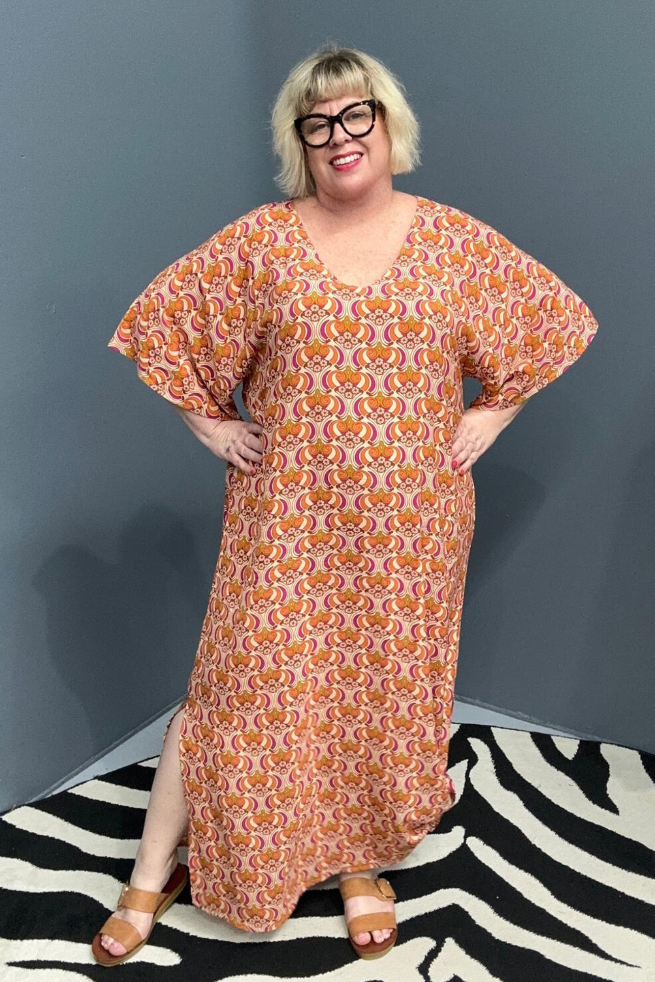 Plus-size orange swirl dress with a flattering fit and effortless flow.
