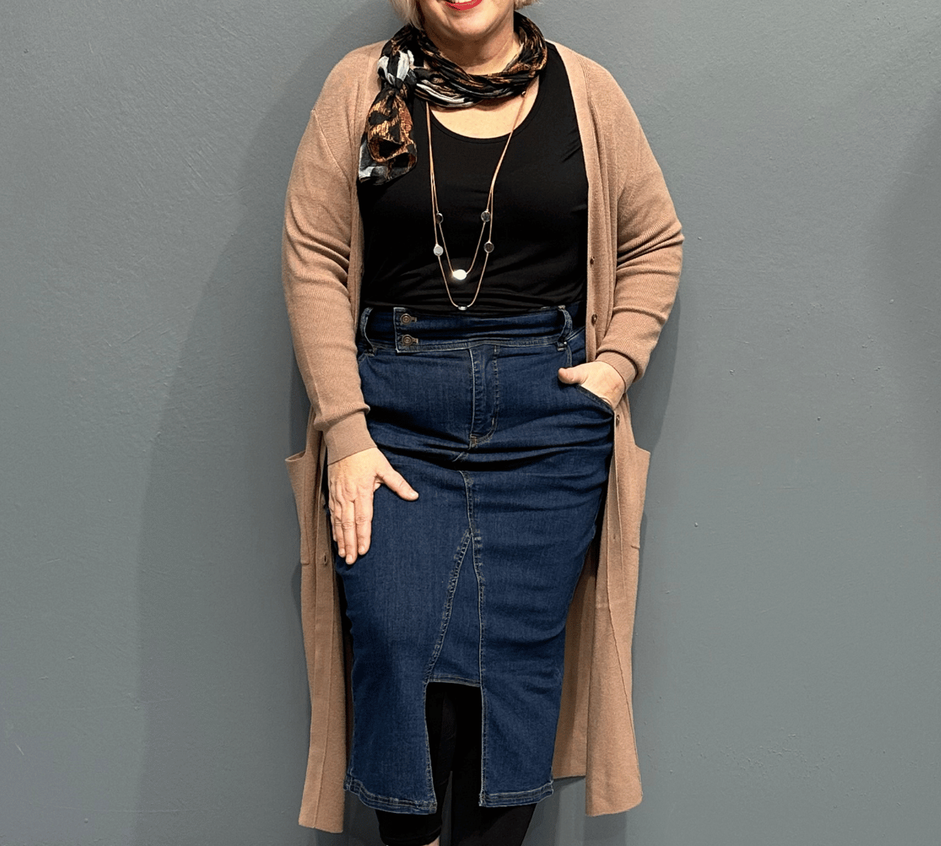 High-waisted stretch denim skirt called 'EMBRACE' designed to flatter curves, perfect for pairing with shirts or tees - Dark Denim.