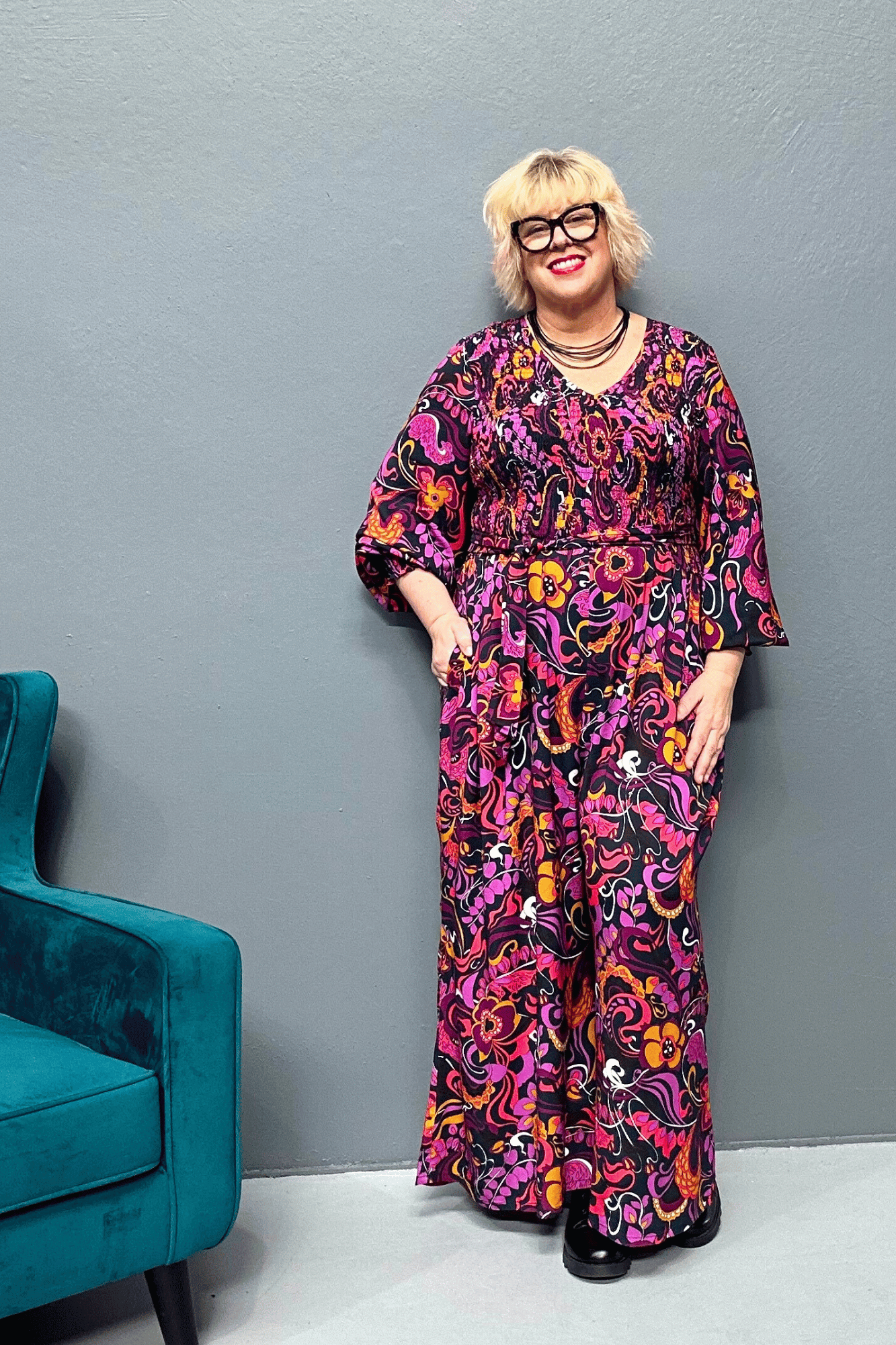 Plus-size wide-leg floral pants with a watercolor design, featuring a flattering high waist and made from cool rayon for year-round wear.