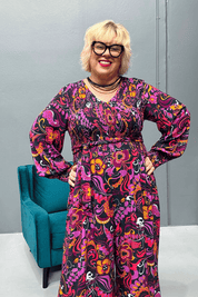 Plus-size wide-leg floral pants with a watercolor design, featuring a flattering high waist and made from cool rayon for year-round wear.