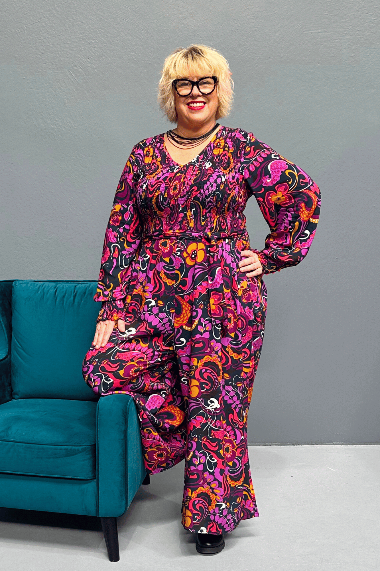 Plus-size wide-leg floral pants with a watercolor design, featuring a flattering high waist and made from cool rayon for year-round wear.