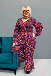 Plus-size wide-leg floral pants with a watercolor design, featuring a flattering high waist and made from cool rayon for year-round wear.