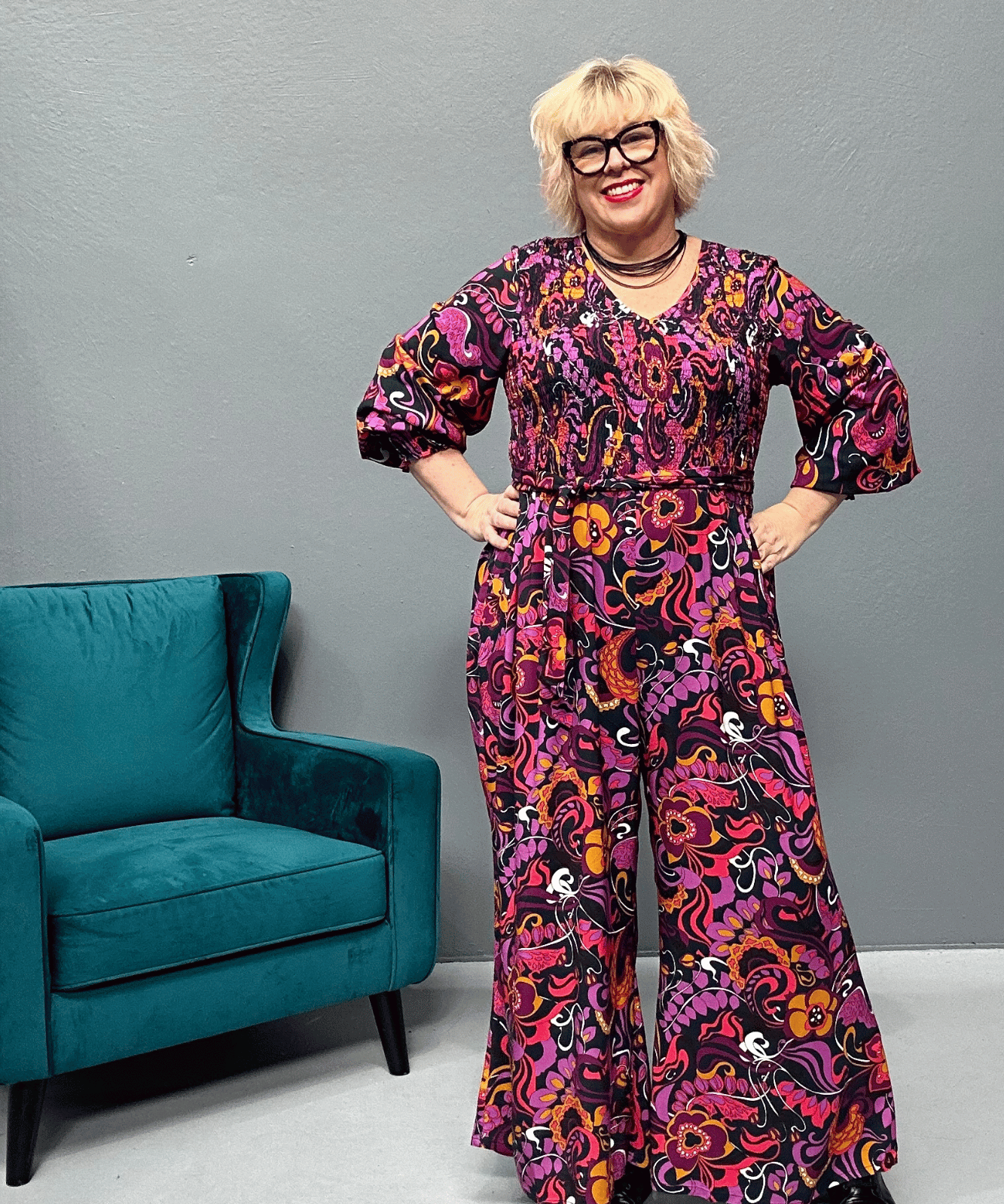 Plus-size wide-leg floral pants with a watercolor design, featuring a flattering high waist and made from cool rayon for year-round wear.