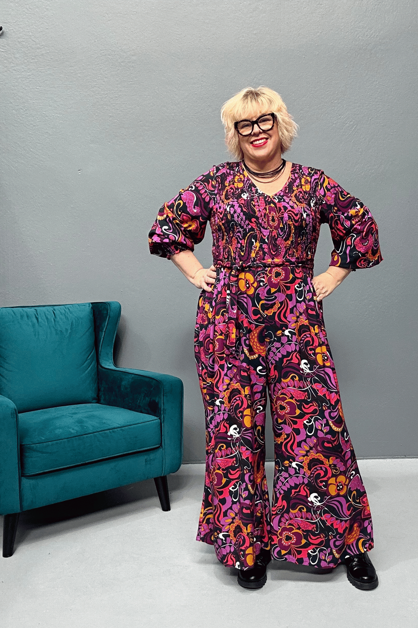 Plus-size wide-leg floral pants with a watercolor design, featuring a flattering high waist and made from cool rayon for year-round wear.