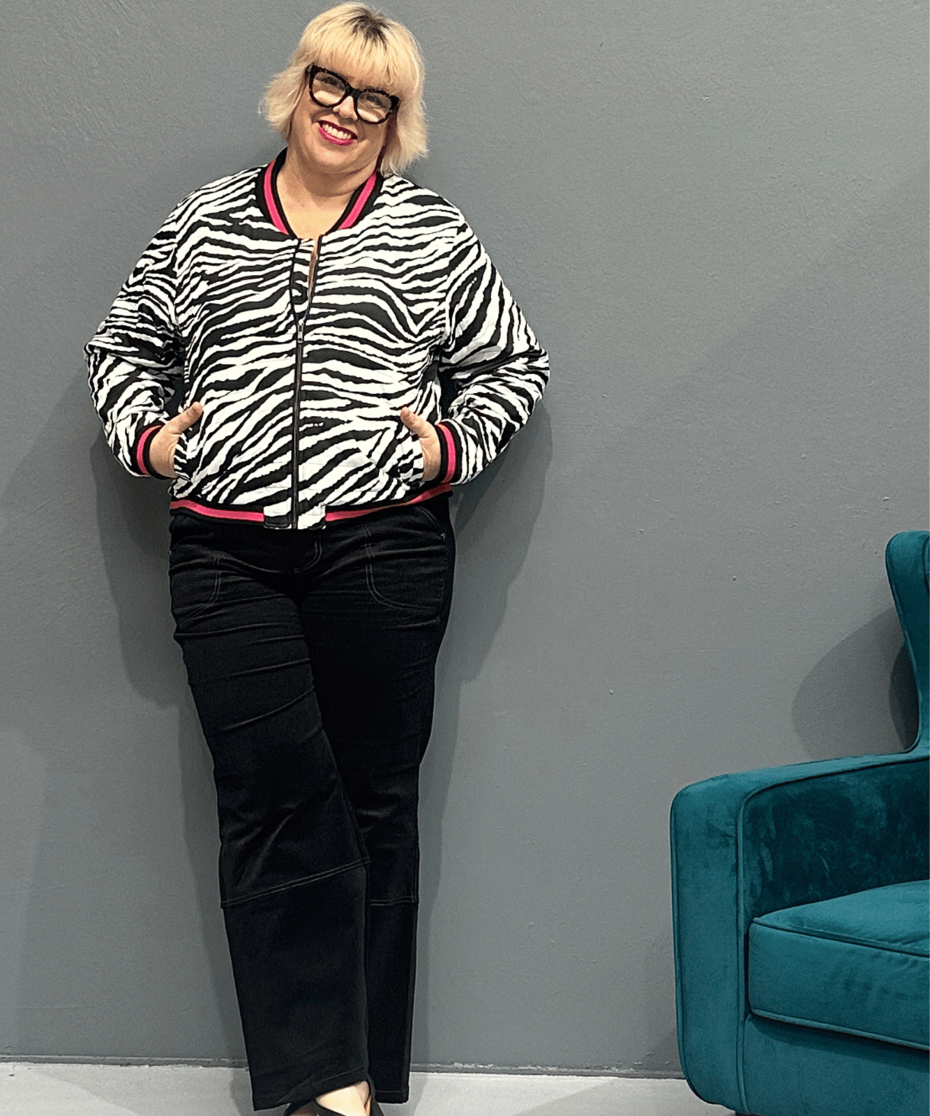 Trendy plus size bomber jacket with bamboo lining, rainproof fabric, cuff detailing, and sequined flamingos on the back.