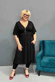  'Goddess' bamboo jersey wrap dress for plus-size women, designed for curvy bodies with a flattering drape.