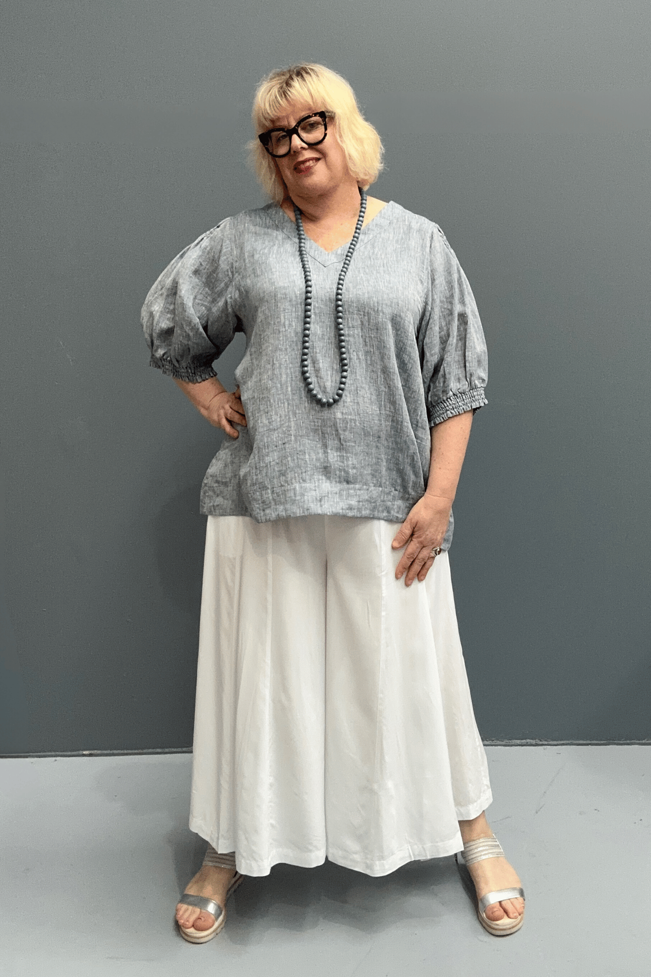 'Holly' plus size linen top with a high-low hem, balloon sleeves, and dropped armholes for comfort and airflow.