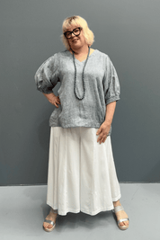 'Holly' plus size linen top with a high-low hem, balloon sleeves, and dropped armholes for comfort and airflow.