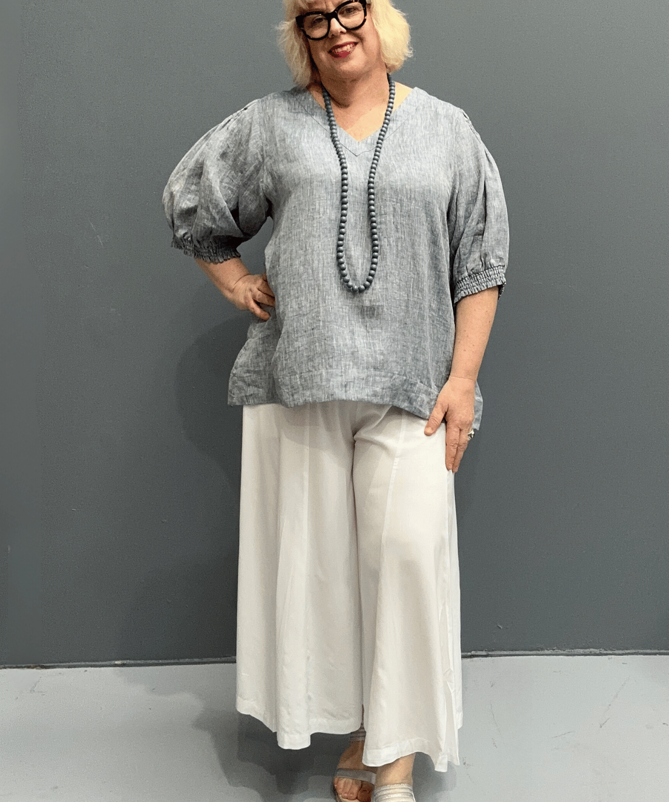 'Holly' plus size linen top with a high-low hem, balloon sleeves, and dropped armholes for comfort and airflow.