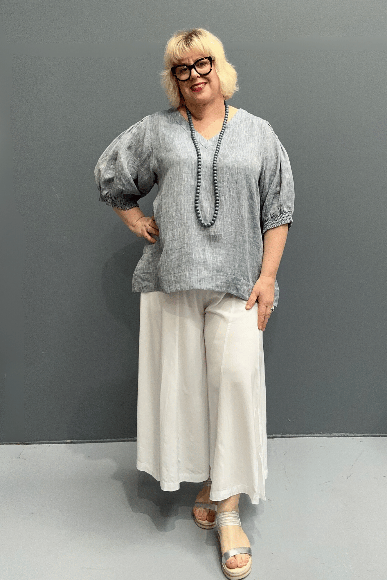 'Holly' plus size linen top with a high-low hem, balloon sleeves, and dropped armholes for comfort and airflow.
