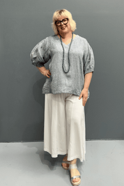 'Holly' plus size linen top with a high-low hem, balloon sleeves, and dropped armholes for comfort and airflow.
