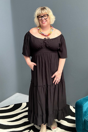 Plus-size black dress with a soft, flowy fit.