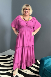 Plus-size fuchsia dress with a soft, flowy fit.