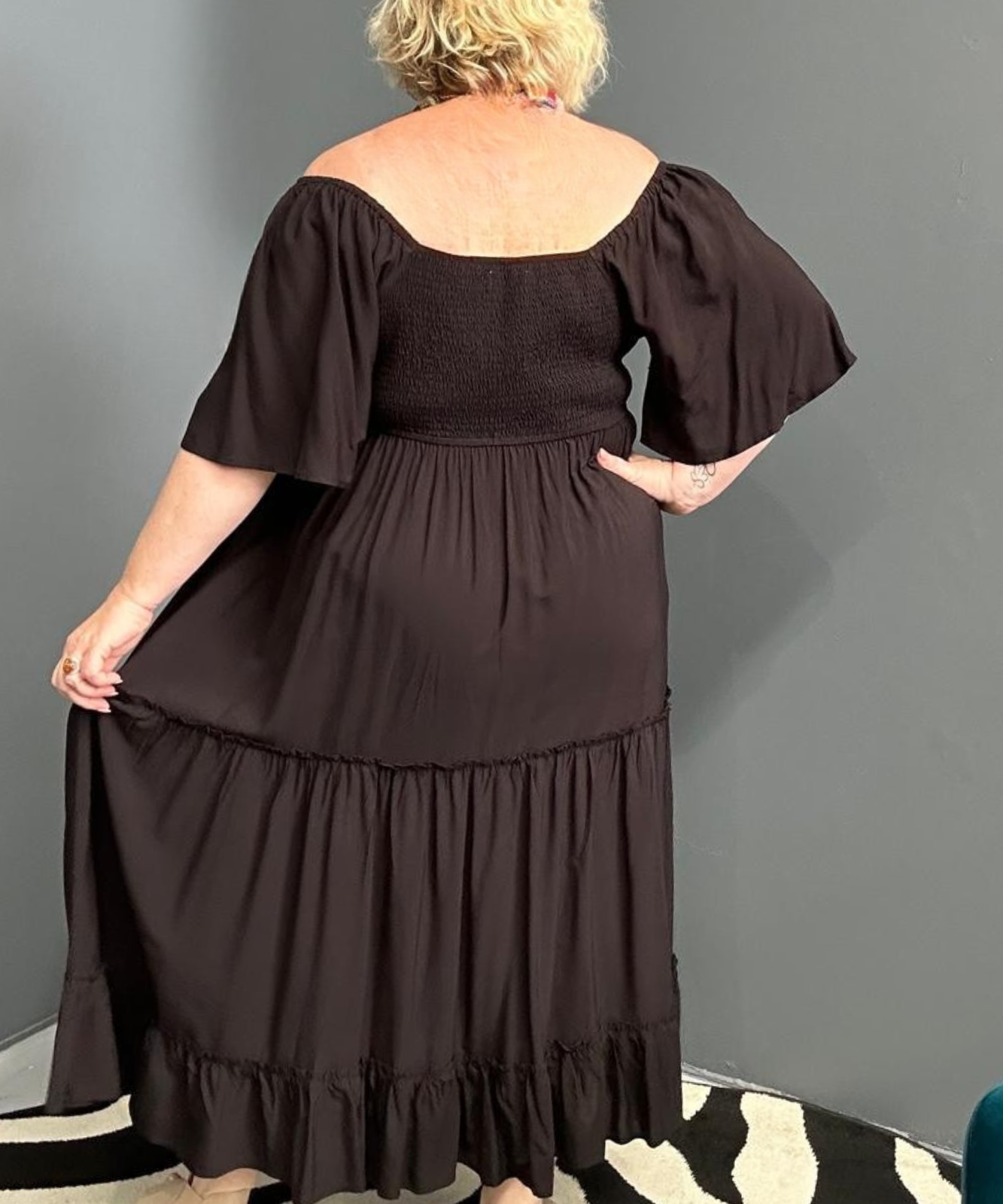 Plus-size black dress with a soft, flowy fit.
