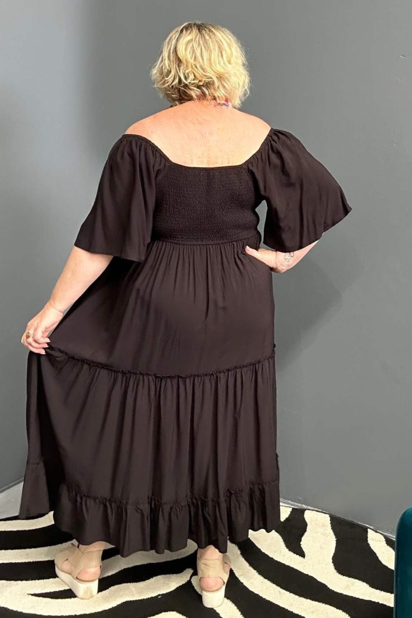 Plus-size black dress with a soft, flowy fit.