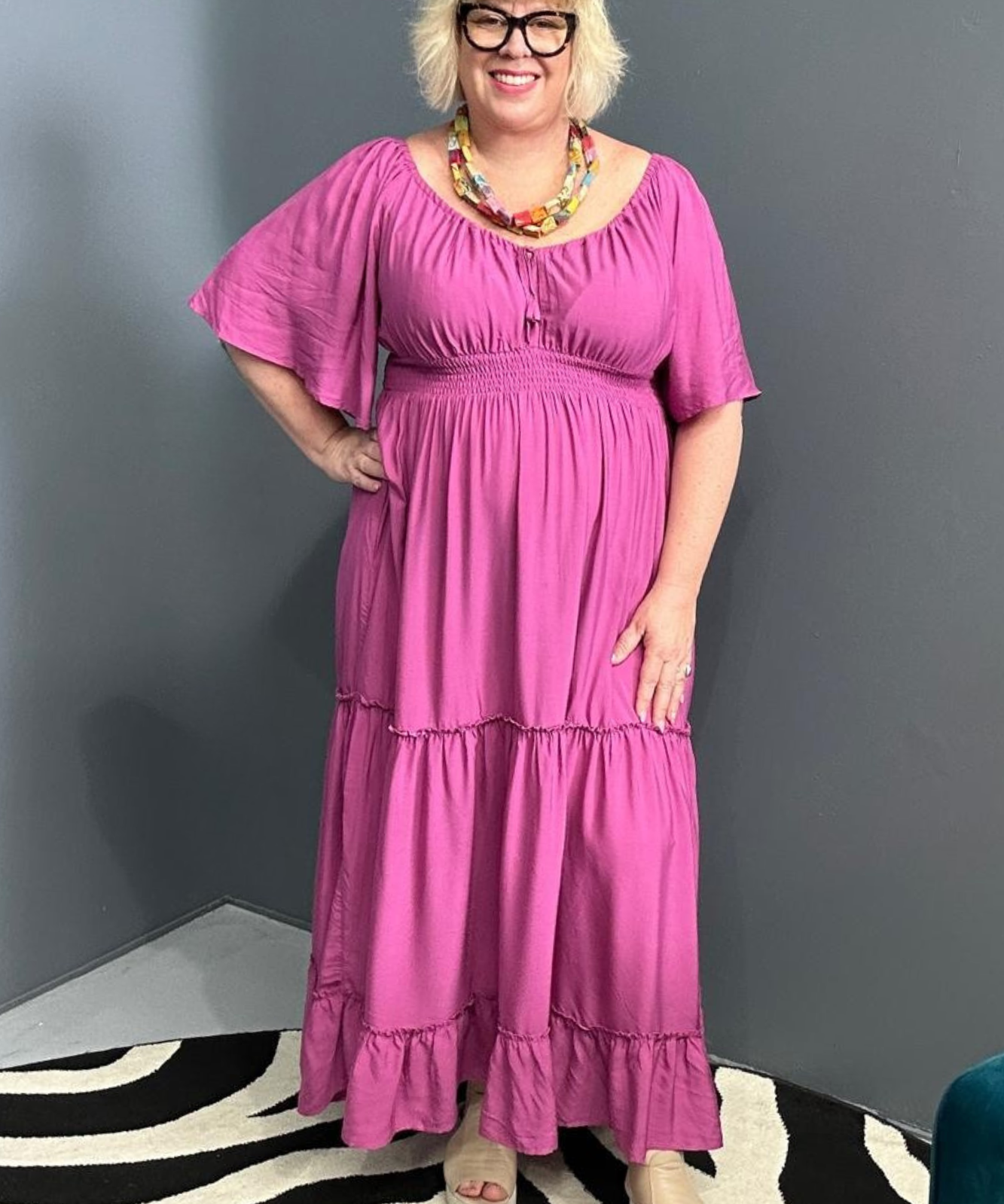 Plus-size fuchsia dress with a soft, flowy fit.