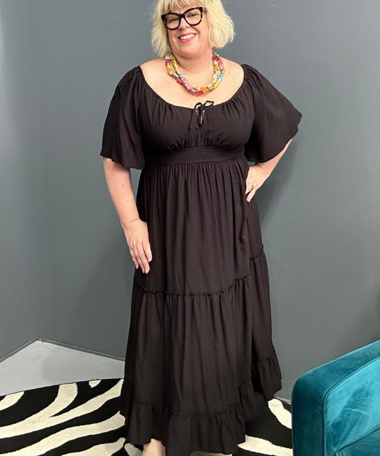 Plus-size black dress with a soft, flowy fit.