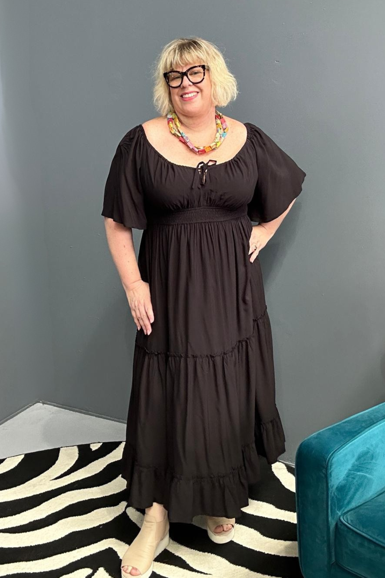 Plus-size black dress with a soft, flowy fit.
