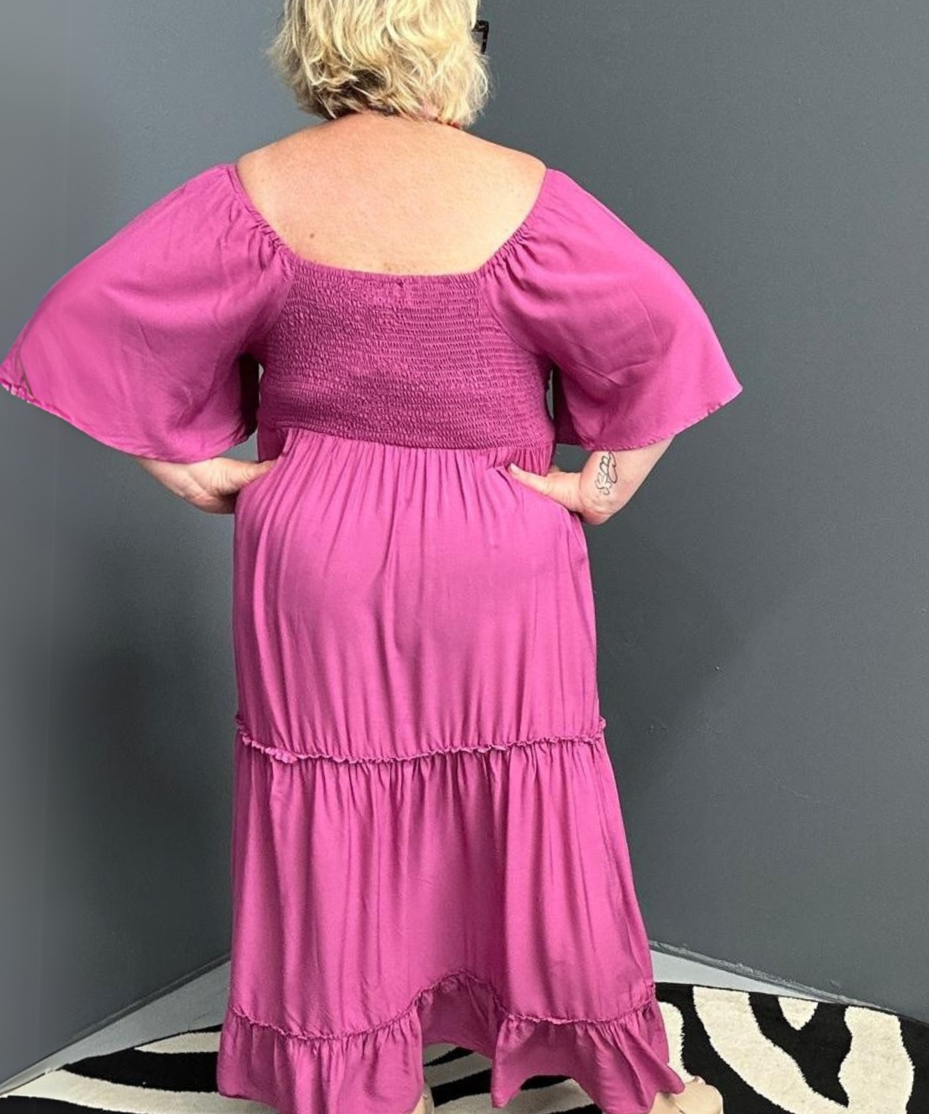 Plus-size fuchsia dress with a soft, flowy fit.