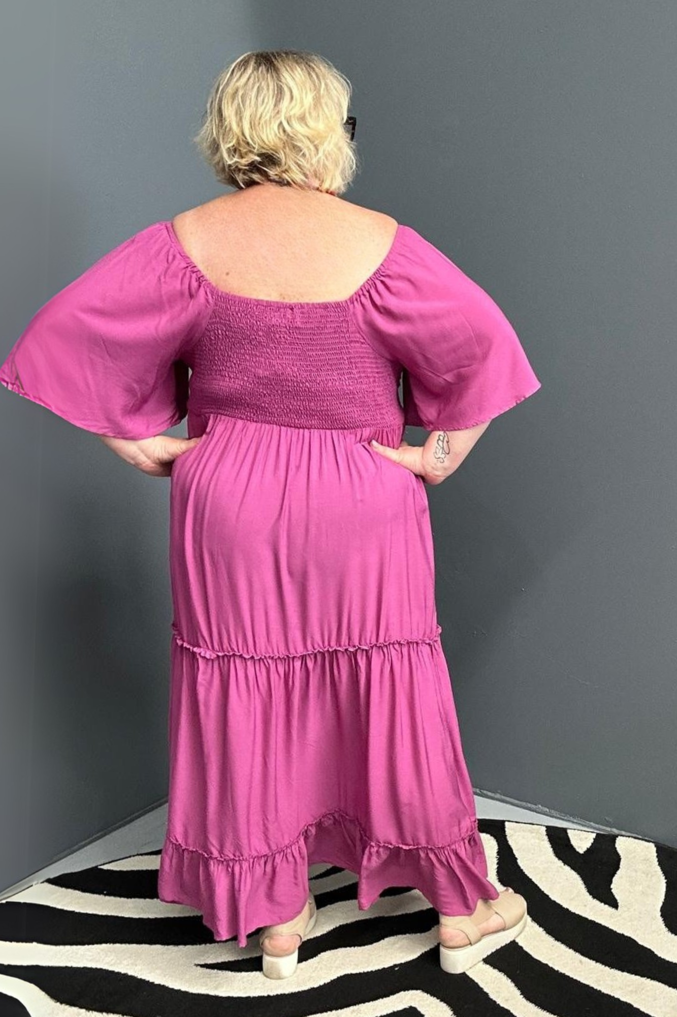 Plus-size fuchsia dress with a soft, flowy fit.